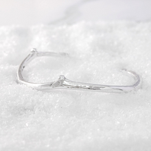 Load image into Gallery viewer, This Twig silver bangle on snow
