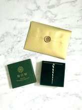 Load image into Gallery viewer, Silver unicorn horn necklace in packaging