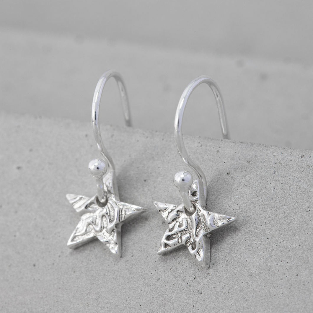 Tiny silver star earrings
